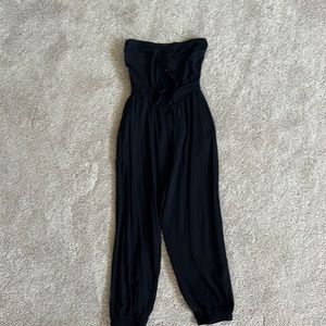 Sleeveless cut out black jumpsuit.